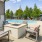 a swimming pool with chairs and umbrellas
