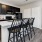 a kitchen with an island and stools